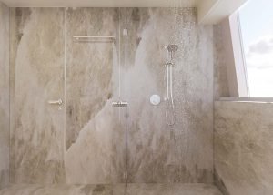 Luksusowa strefa prysznicowa z marmurowym wykończeniem, prezentująca nowoczesne armatury w naturalnym świetle. Projekt odzwierciedla elegancję związaną z Sunreef Yachts.