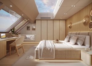 Luksusowe wnętrze sypialni na jachcie Sunreef Yachts, z dużym łóżkiem z jasną kołdrą, sztuką naścienną i drewnianymi wykończeniami. Pokój ma panoramiczne okno, biurko z laptopem i wbudowane oświetlenie.
