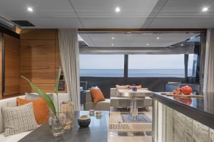 Luxurious interior of a Sunreef Yachts catamaran with a stylish living area and a view of the ocean.